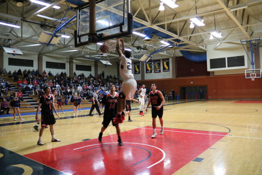 First-year guard Malcom Jenkins rises up for the dunk in the Bear Cubs win Saturday; beating Foothill College 83-78.