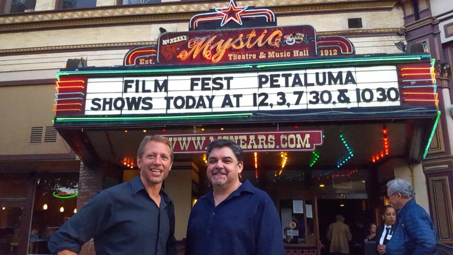 SRJC Media Instructor and Festival Director Mike Traina and fellow Instructor Brian Antonson pose in front of the historic Mystic Theater, the site of this years Petaluma Film Festival.