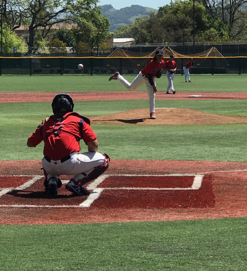 Patrick Keamoi warming up with catcher Cole Brodnansky before his second career start.