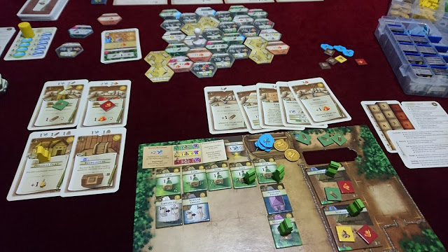 By+the+second+era%2C+The+Colonistss+play+area+is+crowded+with+cards%2C+notes+and+game+pieces.