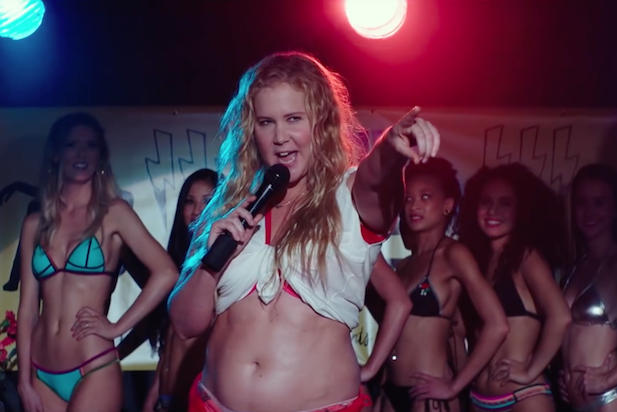 Amy Schumer performs on stage during a scene in her new movie, "I Feel Pretty."