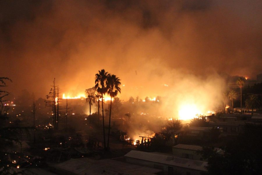 Fires rage in the hills of Fountaingrove over the ruins of Journey’s End Mobile Home Park on the morning of Oct. 9.