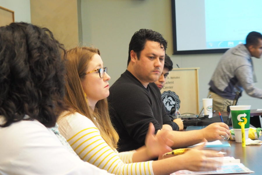 Vice President of Marketing Anamaría Morales talking about CubCard+ membership's new posters to the rest of SGA. Later in the meeting she resigned from her position.