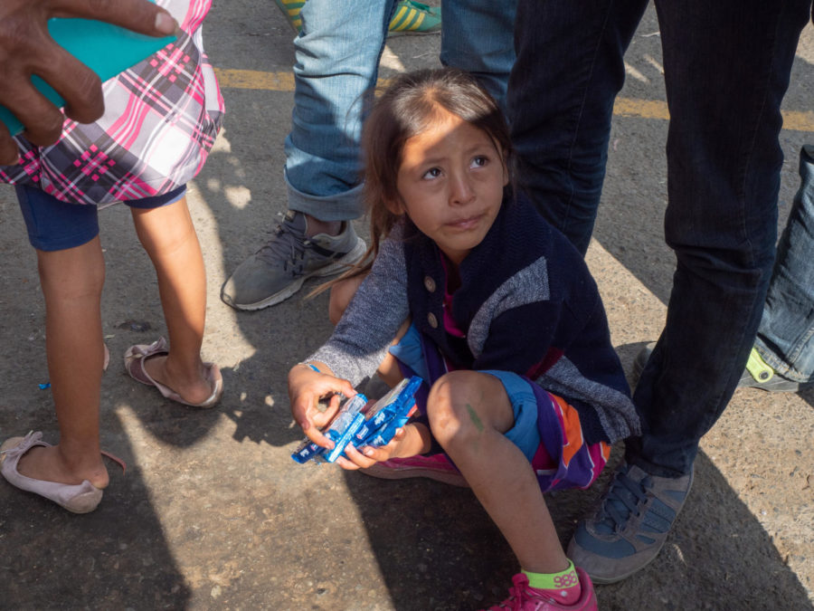 A child cries as her uncle explains the disappearance of her mother the night before. 