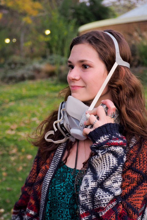 SRJC student Katrina Ribinius wears an N95 mask to protect herself from the airs toxicity.