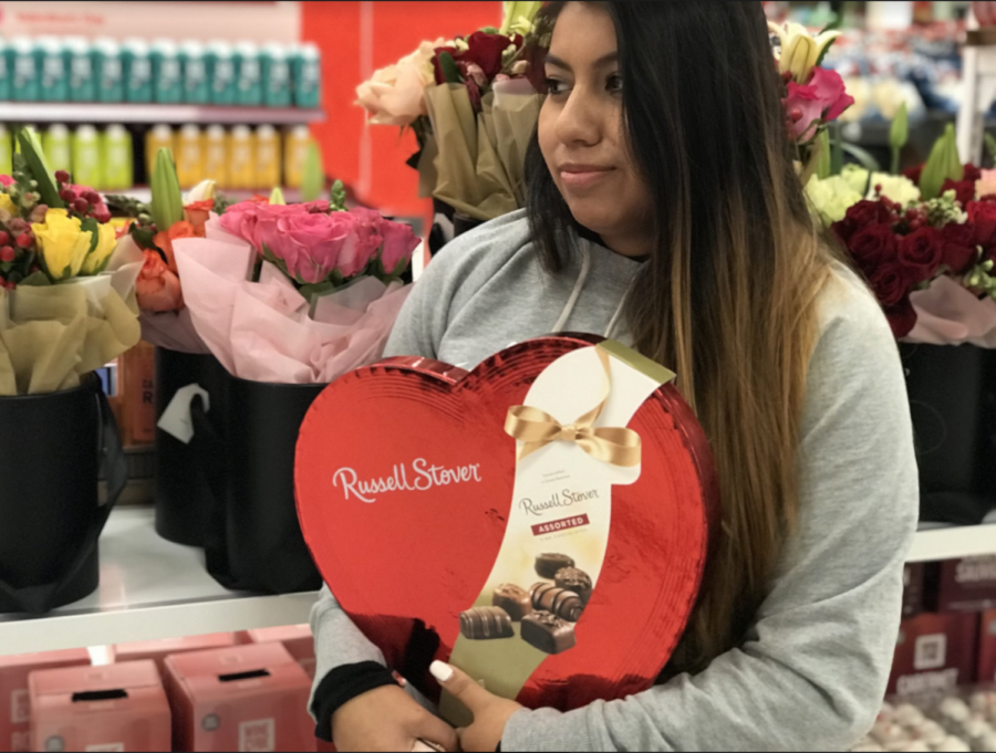Santa Rosa resident Jasmine Rosas buys herself a box of chocolates for Valentine's Day.