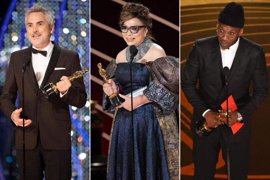 Alfonso Cuarón (Best Cinematography for Roma, Ruth E. Carter (Best Costume Design for Black Panther) and Mahershala Ali (Best Supporting Actor for Green Book) accept their wins on the Oscars stage.