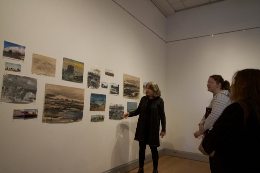 Artist Stephanie Sanchez speaks to attendees about her show Meanderings at the Robert F. Agrella Art Gallery. 