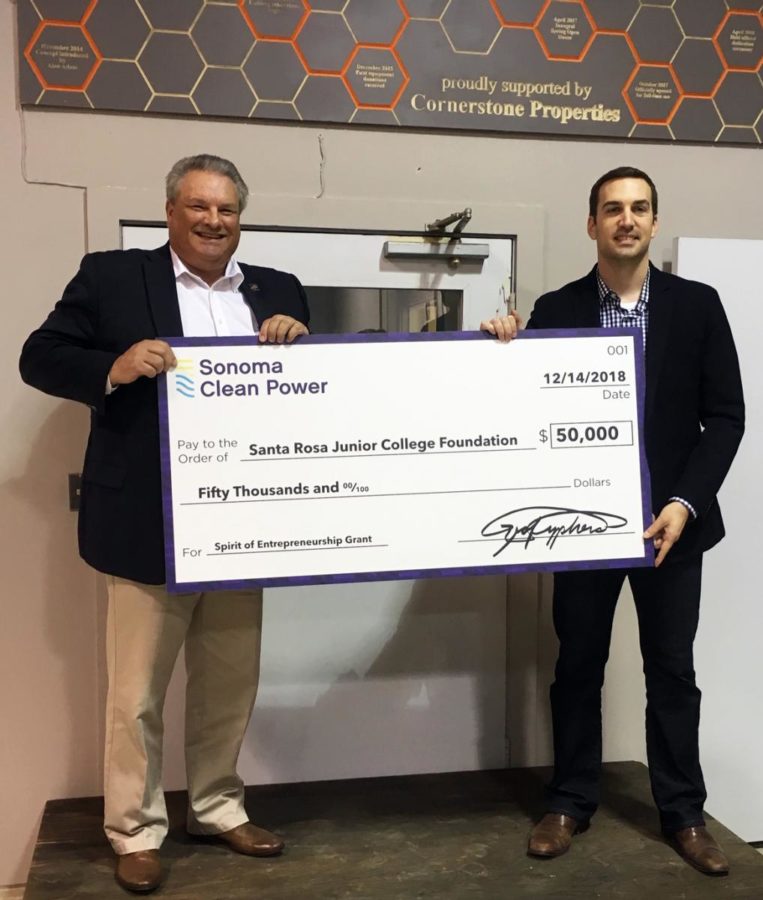 Nathan Kinsey, Commercial Accounts Manager at Sonoma Clean Power stands with Jerry Miller., dean of Career Education.
The check is now in the Business office in Maggini Hall at Santa Rosa Junior College.