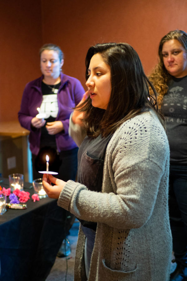 Take Back the Night host Jocelyn Toscano prepares for a moment of silence during a candle light vigil in honor of sexual assault survivors, March 27 in the Student Activities Center.