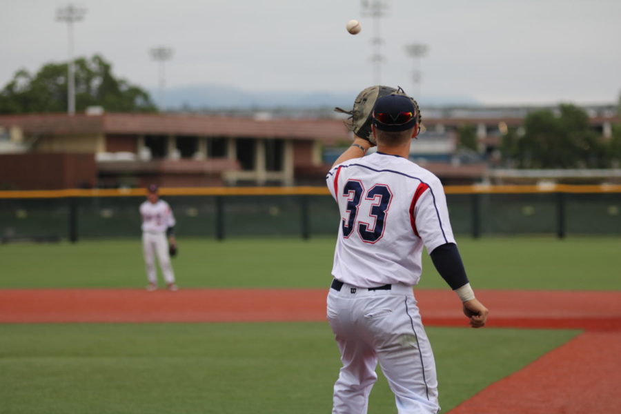 Santa+Rosa+Junior+Colleges+freshman+catcher++Aidan+Morris+helps+the+outfielders+warm-up+before+the+Bear+Cubs+10-5+loss+Thursday.