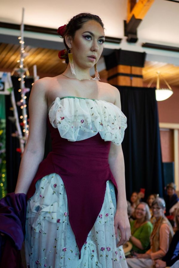 Shae Bent modeling her dress at the fashion show at the Day Under the Oaks event in the Bertolini Student Center