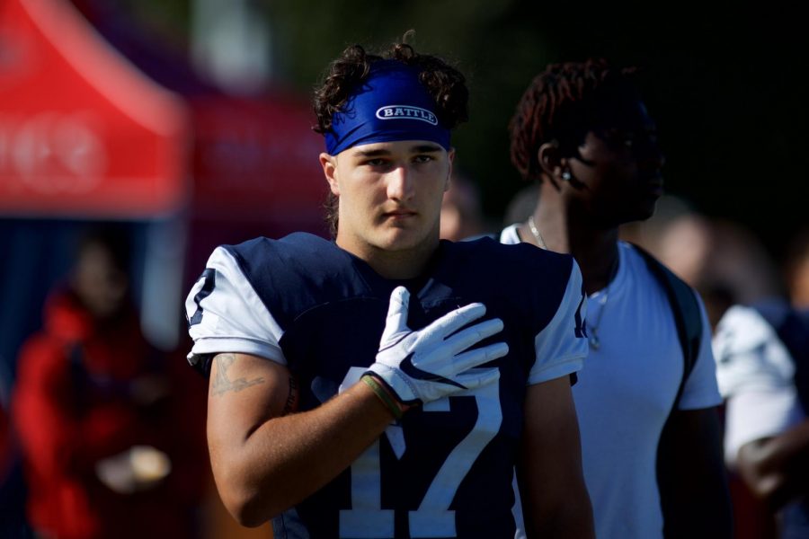 SRJC linebacker Dawson Trent prepares for the game during the National Anthem. 