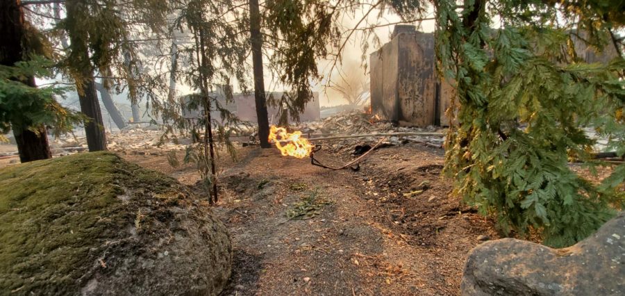 Gas continues to flow from a leak in a burned down building. 