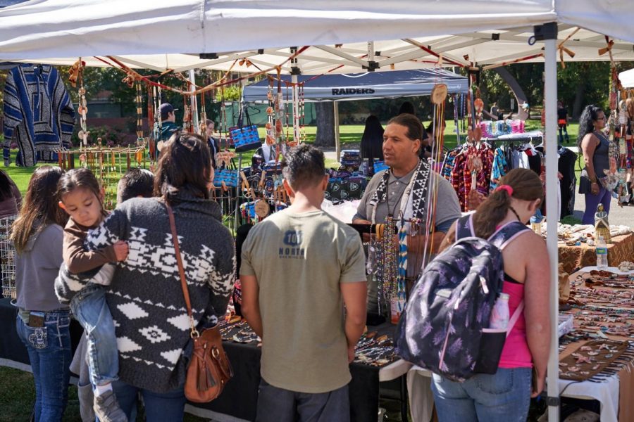 A vendor sells necklaces at SRJC's Indigenous People’s Day celebration in Bertolini Quad.