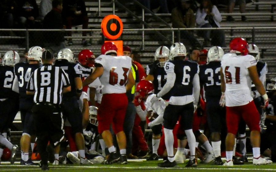 Santa Rosa Bear Cubs and San Francisco Rams players emerge from a dogpile during the Rams' 30-24 victory over the Bear Cubs Saturday at Santa Rosa High School.