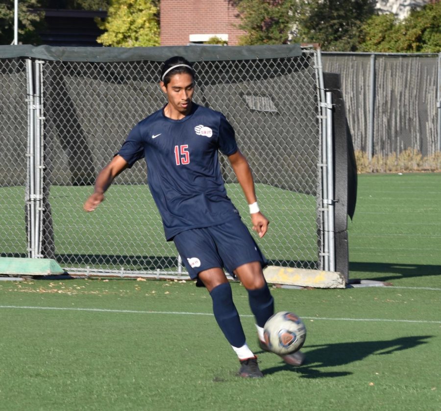 Bear Cubs defender Carlos Villanueva kicking the ball away from his own goal. 