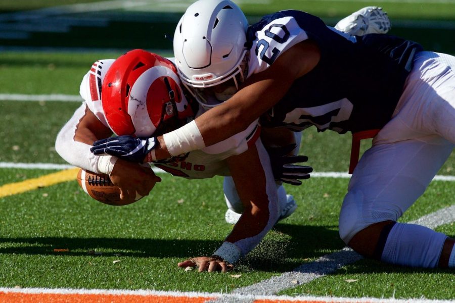 SRJC+safety+Kasey+Kikuyama+demonstrates+a+perfect+form+tackle+against+Fresno+College+Sept.+7.+Though+there+is+slight+helmet+to+helmet+contact%2C+Kikuyama+leads+with+his+shoulder+and+wraps+up+nicely.