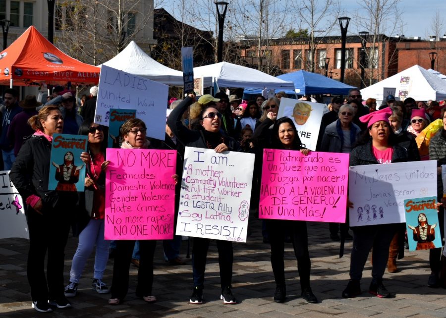 Latina protesters chant “si se puede,” which is Spanish for “yes we can," to show their support of the speakers in Old Courthouse square.