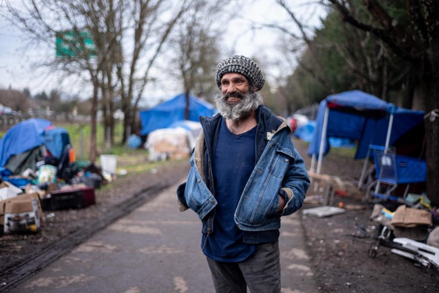 Seth Hagedon, the self-appointed comedian of the Joe Rodota Trail homeless community, admires the artistic spirit and energy along the trail and thinks many of the residents are happy to live on the street. 