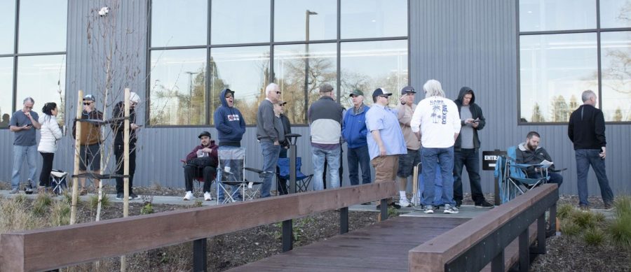 Customers sit, read and talk among themselves as they anticipate the release of the coveted beer.