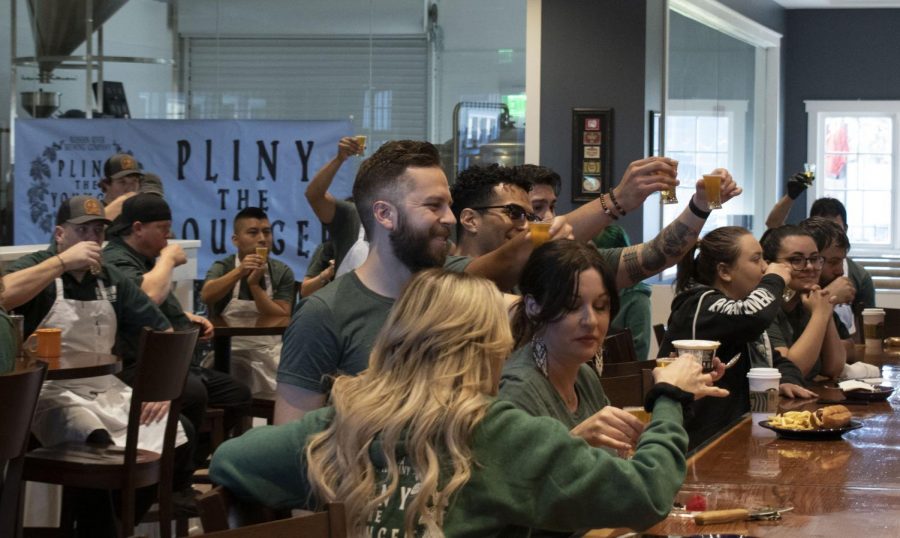 RRBC employees salute with taster glasses of Pliny the Younger just minutes before the restaurant doors open.