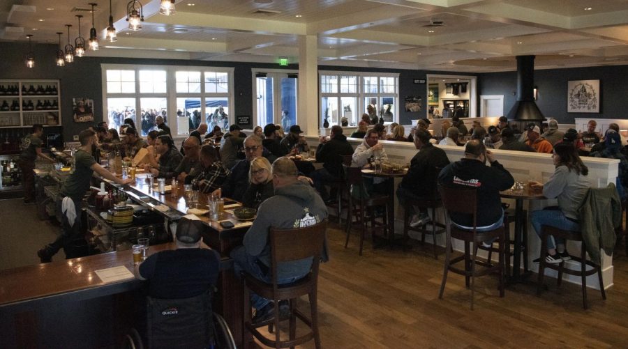 The first wave of people taste the much-anticipated Pliny the Younger in RRBC's main dining room, while hundreds continue to wait their turn in line outside.