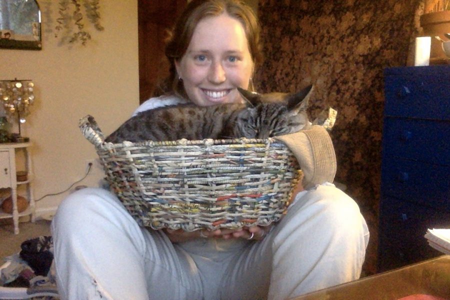 Alexis Trinei, who loves being at home during the pandemic, and her cat Lucy.