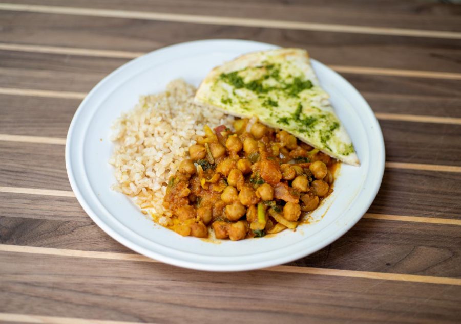 Chana masala, brown basmati rice and naan bread topped with cilantro chutney 
 - reheated the next day for a perfect vegan lunch.