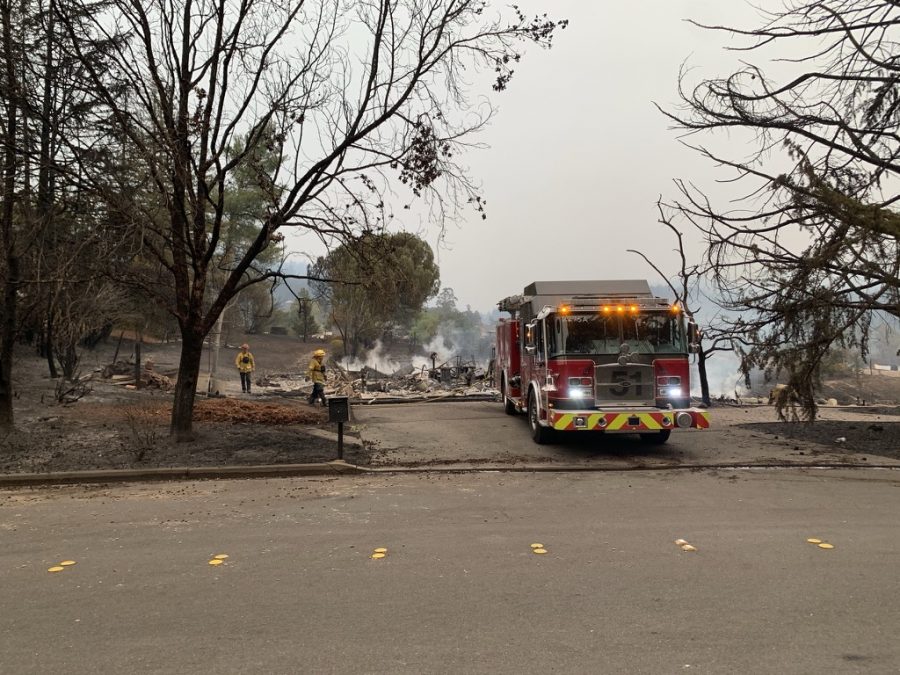 Firemen inspect remains of demolished houses in Skyhawk.