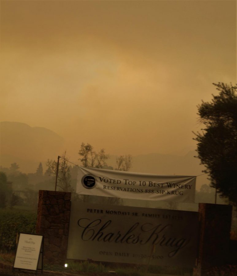 An orange sky hangs over Charles Krug Winery off Highway 29.