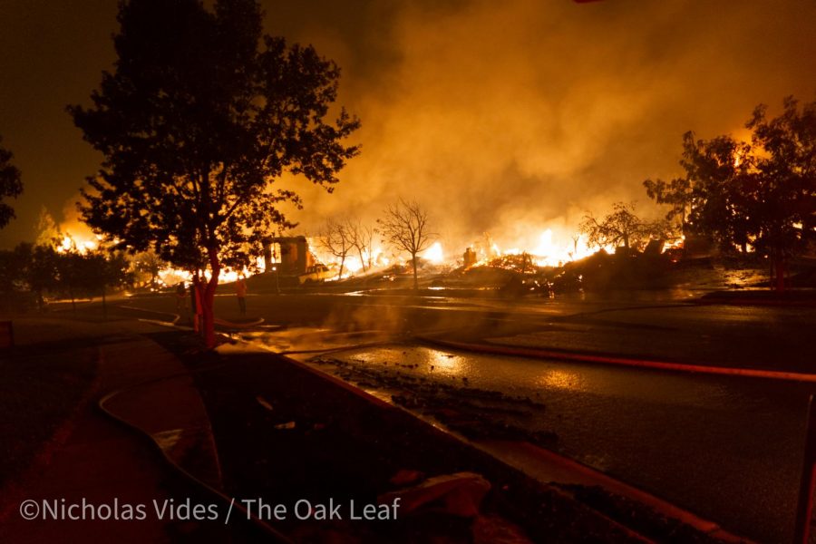 The Shady Fire burns through the 5800 block of Mountain Hawk Drive at 3:30 a.m. Monday.