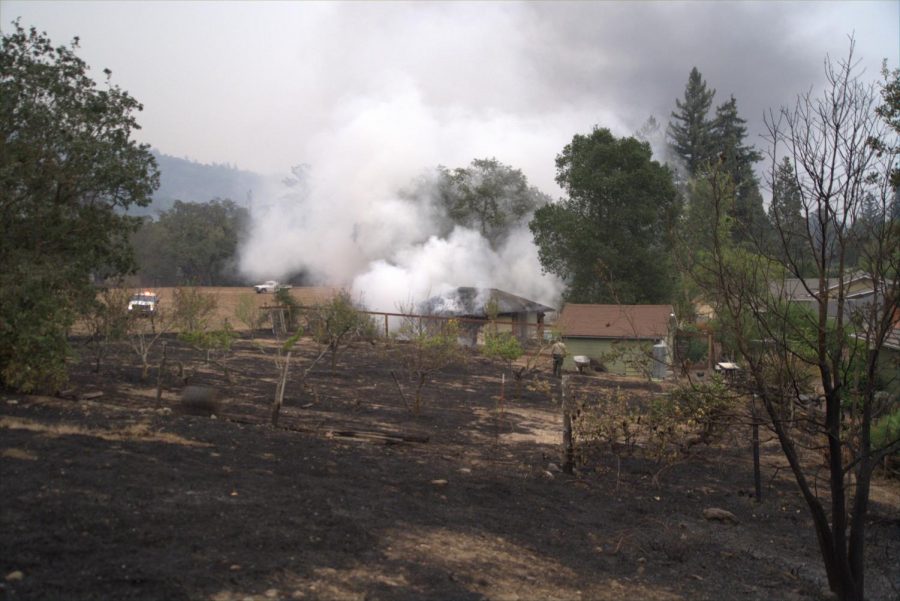 Smoke billows from a pool house as firefighters put out a fire in the Skyhawk community. 