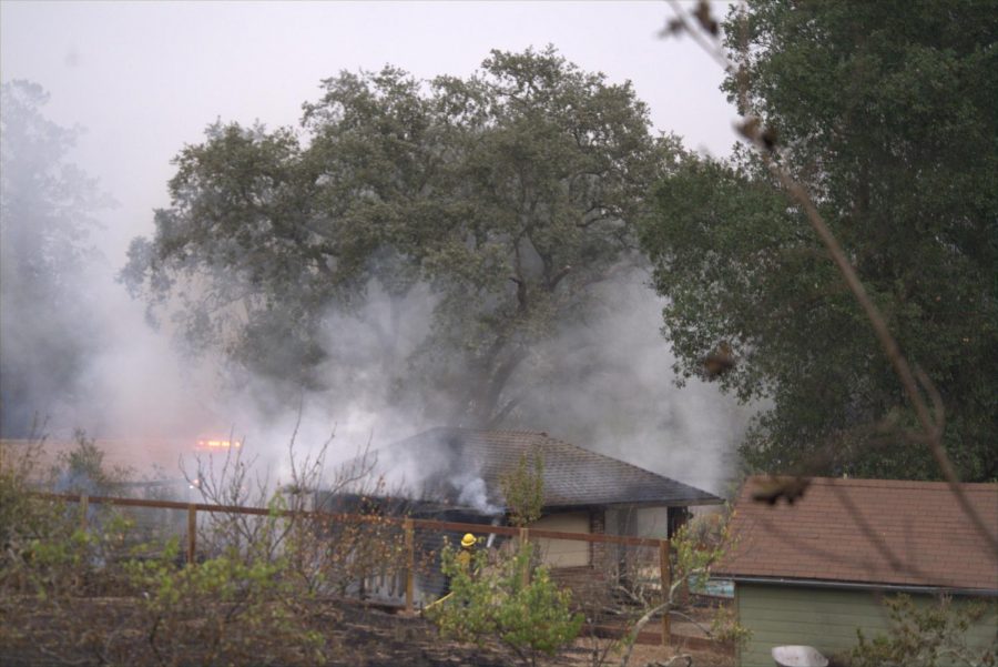 Firefighters douse flames on a pool house in east Santa Rosa's Skyhawk community.