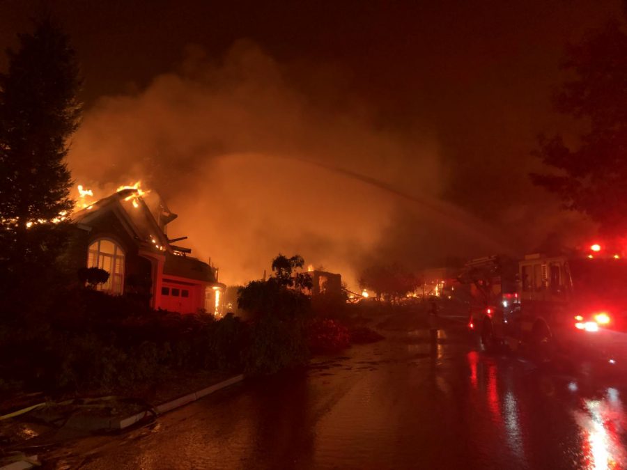 Firefighters attempt to save homes on Mountain Hawk Drive in Santa Rosa's Skyhawk community at around 3:45 a.m. Sept. 28. 