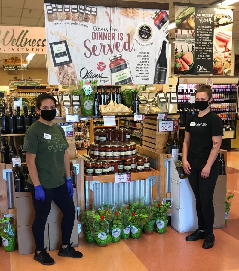 SRJC student Amy Aguilar Lopez (pictured left) and former SRJC student Julia Dearing (pictured right) ensure customers wear adequate personal protective equipment inside Oliver's Market.