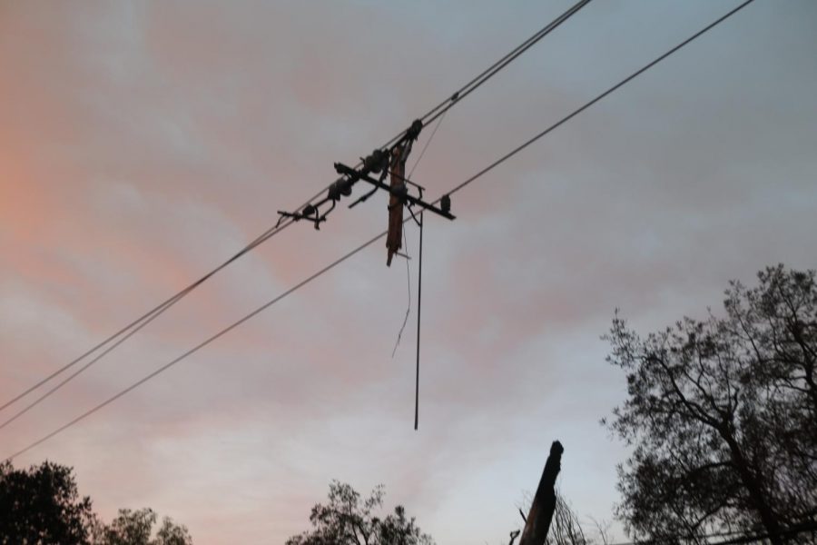 A utility pole along Hwy 12 that caught fire, resulting in the pole splintering into three pieces.