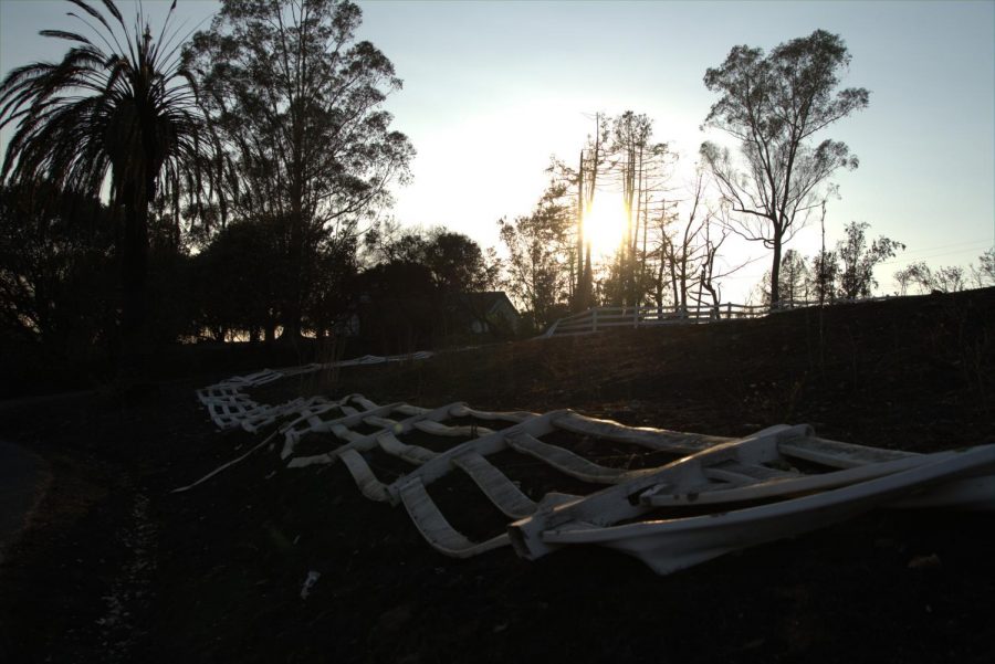 A metal fence warped from the heat during the Glass Fire