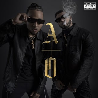 The album cover of Anuel AA and Ozunas Los Dioses, featuring the men standing in a smoky room wearing dark clothing.