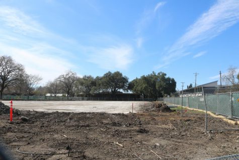 A temporary fence surrounds the remains of the demolished Shuhaw Hall.