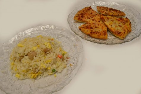 A plate of fried rice is on the left and a plate of cheese pizza is on the right.