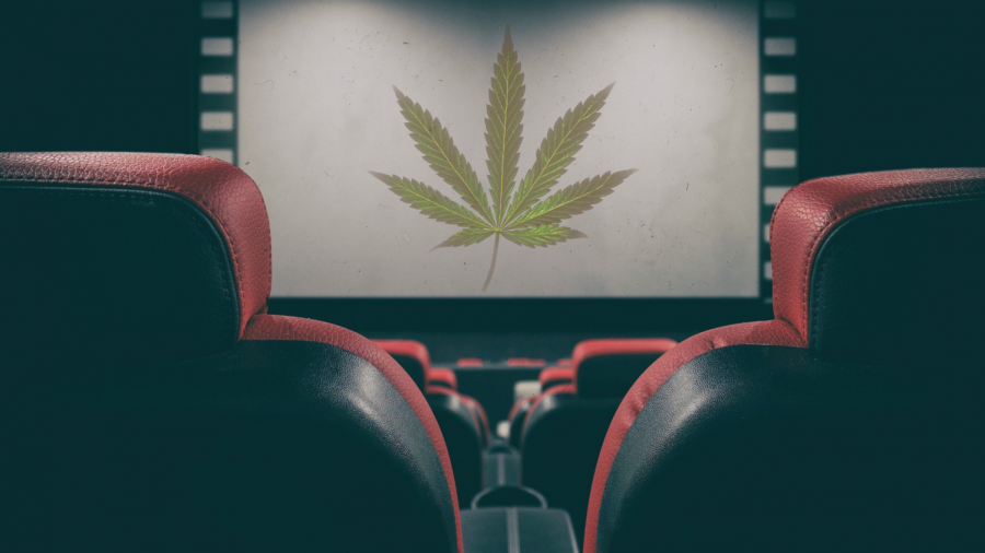 A graphic of movie theater seats in front of a movie screen that has a marijuana leaf on display.