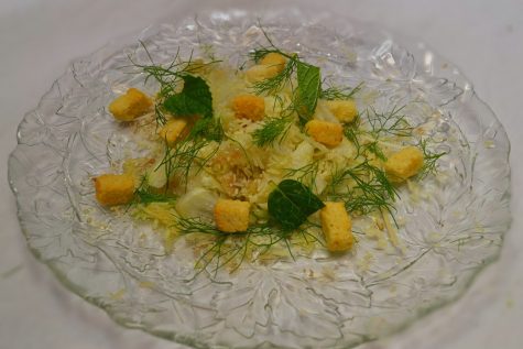 A picture of a fennel salad with croutons and mint.