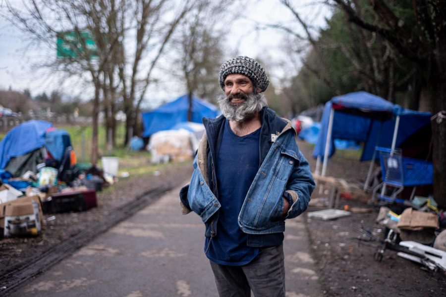 Seth Hagedon, the self-appointed comedian of the Joe Rodota Trail homeless community, admires the artistic spirit and energy along the trail and thinks many of the residents are happy to live on the street.