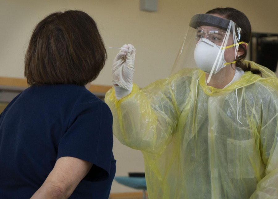 A nurse demonstrates the COVID-19 testing procedure at the SRJC Petaluma campus.