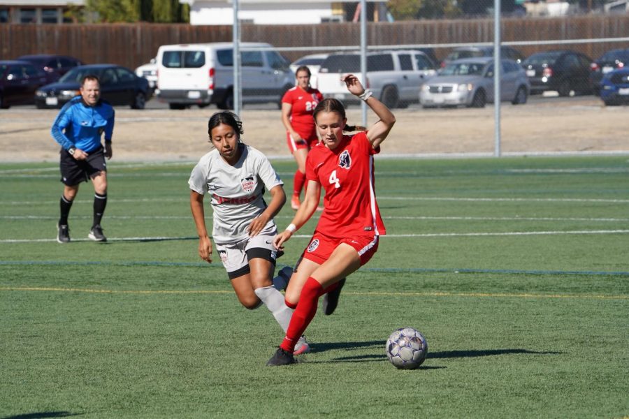 SRJC midfielder Abria Brooker changes direction against Sierra defender Paulina Caja Duran to try to continue momentum towards the goal during the second half of the game in SRJCs loss to Sierra College Oct. 15. 