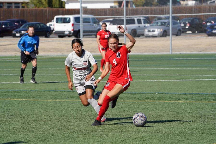 SRJC midfielder Abria Brooker changes direction against Sierra defender Paulina Caja Duran to try to continue momentum towards the goal during the second half of the game in SRJC's loss to Sierra College Oct. 15. 
