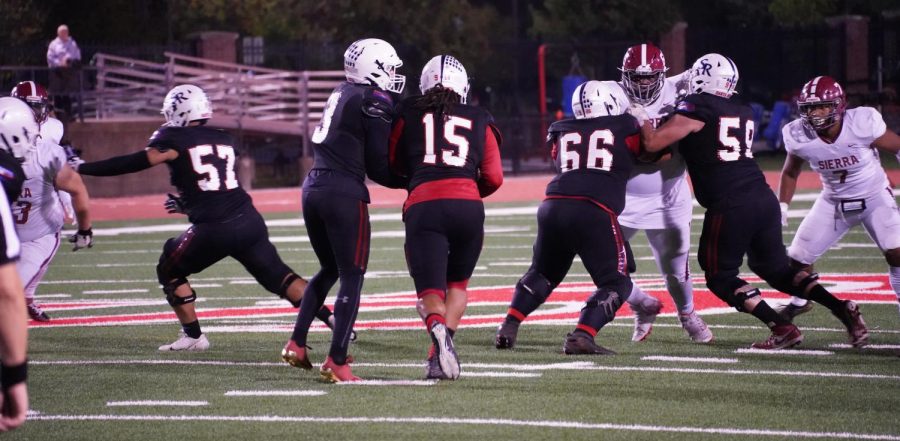 Quarterback Jake Simmons (3) hands the ball off to fullback Devonte Manning (15) where he moves the chains for the Bear Cubs gaining a first down on the run on Nov. 13 at Bailey Field.