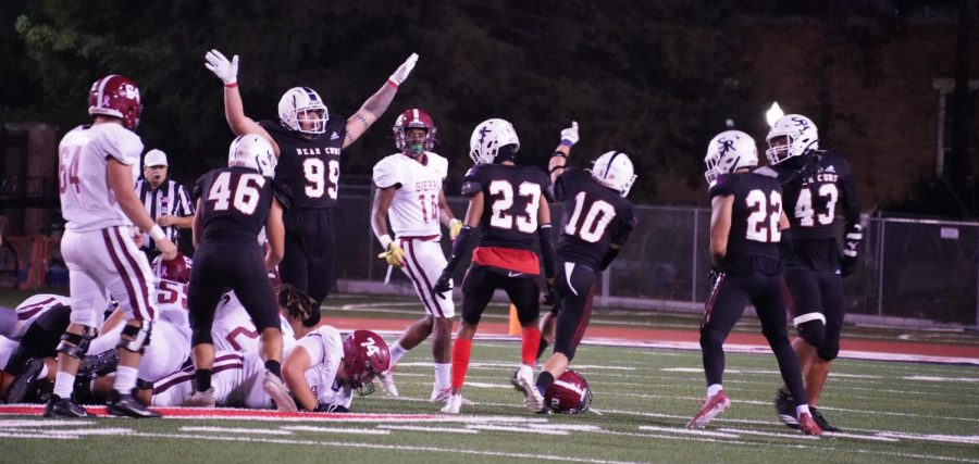 The Bear Cub defense celebrates as they stop Sierra’s fourth down conversion attempt to cause a turnover on downs and give the ball back to their offense on Nov. 13 at Bailey Field.