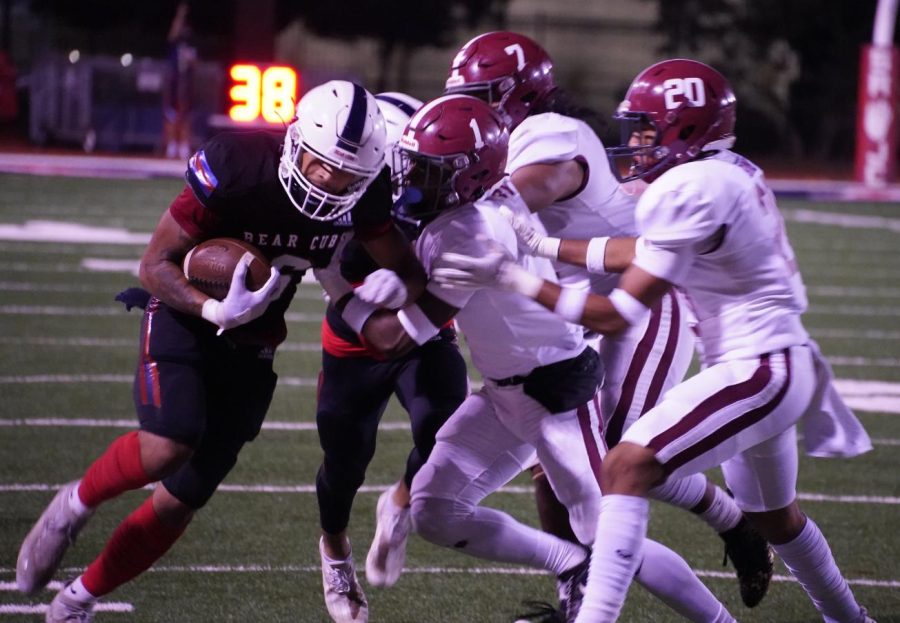 Wide receiver Micah Fontenot (6) carries two defenders with him into the endzone for Fontenot’s first touchdown of the night on Nov. 13 at Bailey Field.